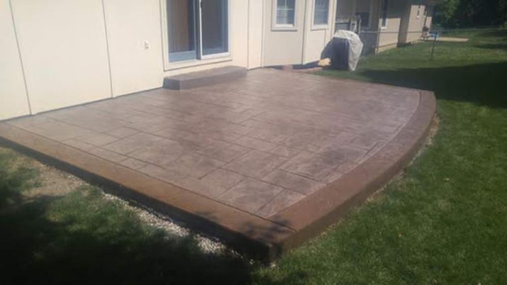 Brown stamped concrete patio Kansas City — warm-tone residential | Ford Concrete