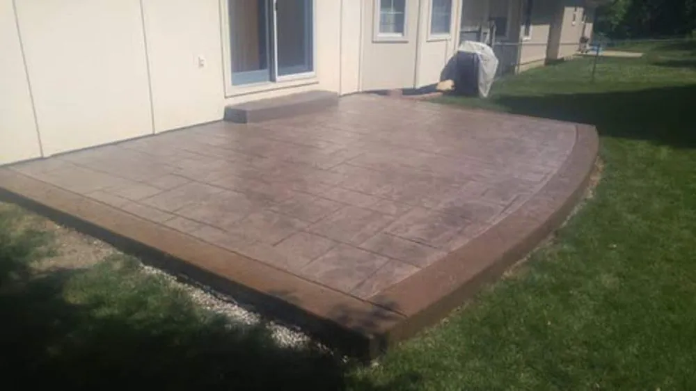 Brown stamped concrete patio Kansas City — warm-tone residential | Ford Concrete