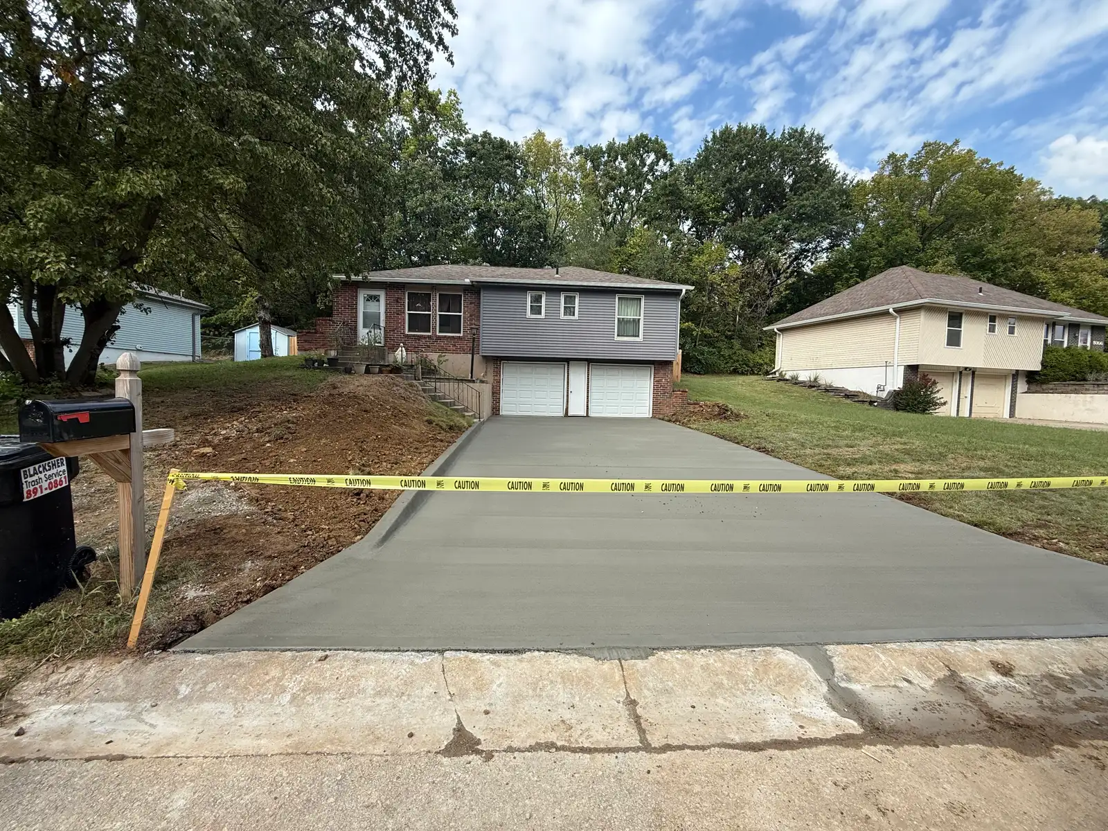 Concrete driveway resurfacing Kansas City — freshly poured overlay | Ford Concrete