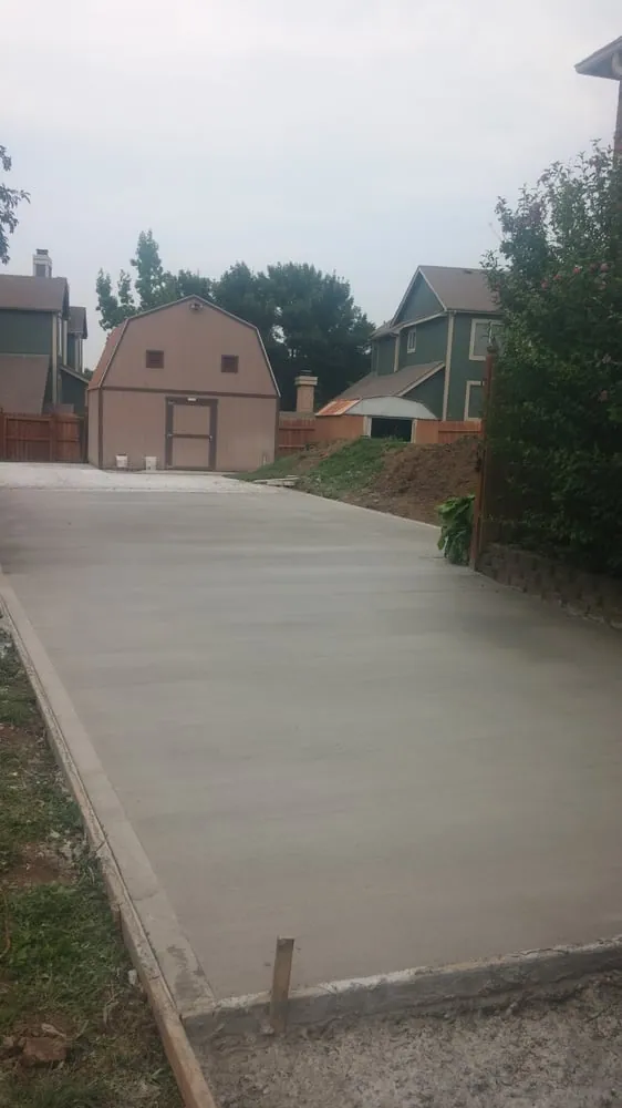 Long concrete driveway installation Kansas City — residential property | Ford Concrete