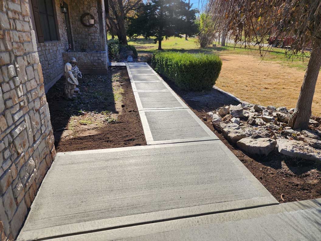 Concrete front walkway Kansas City — broom-finished surface | Ford Concrete