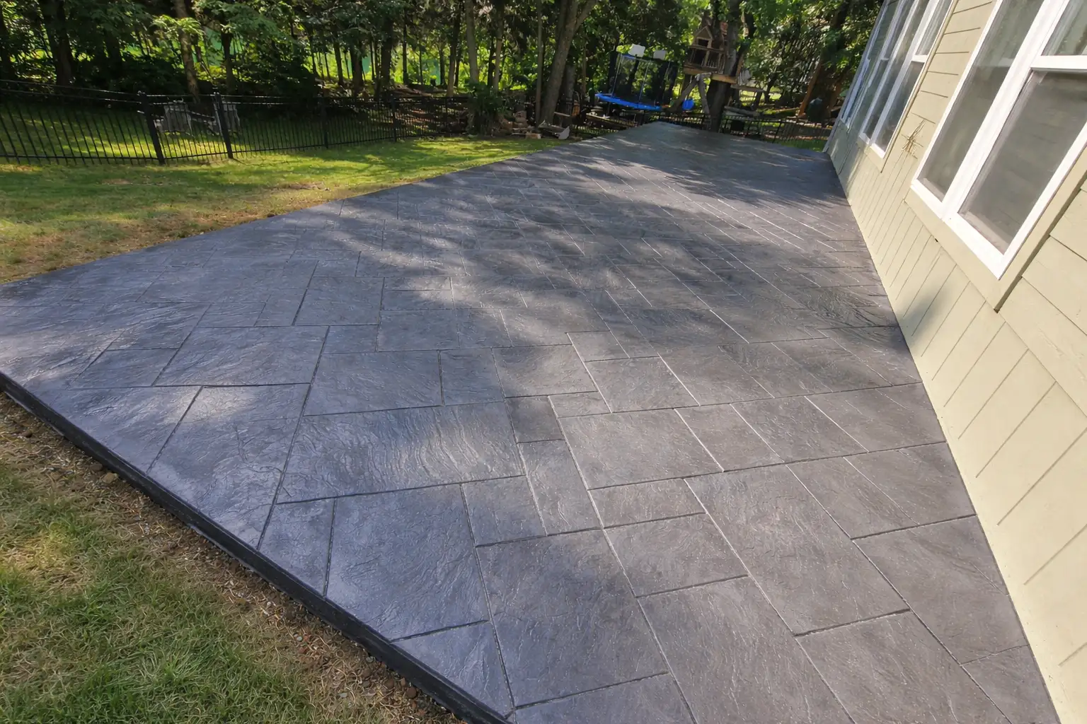 Stamped concrete patio Kansas City — ashlar slate pattern | Ford Concrete